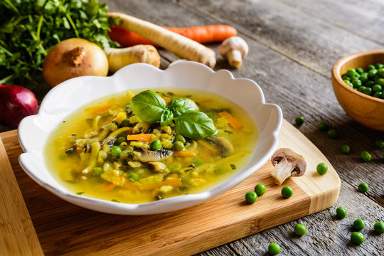 Mushroom soup with carrot, pea, kale, parsley, celery and onion