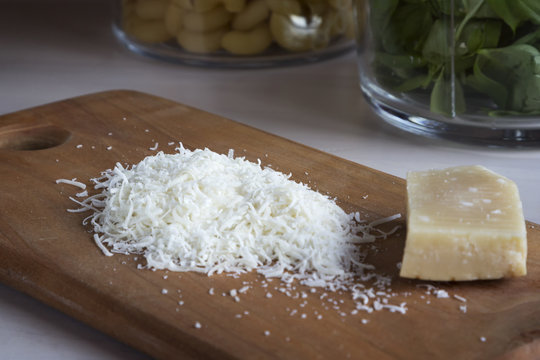 Finely grated Parmesan cheese on the board