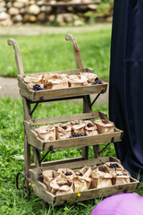 Fresh blueberries in paper bag. Posted in wooden wagon.