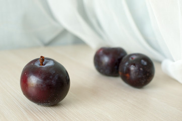 Ripe plums on a table