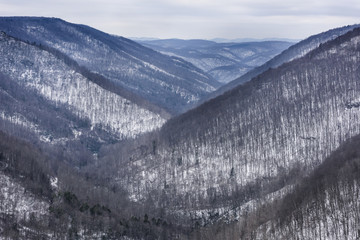 Snow Covered Valley and Mountains in Winter