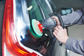 auto mechanic buffing car autobody