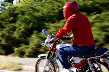 Middle age man riding motorcycle