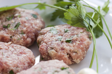 Dish of meatballs with garlic and parsley
