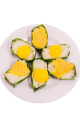 Thai dessert sticky rice with coconut custard packing by banana