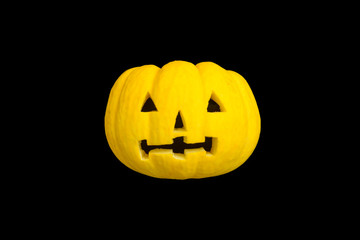 Ghost face on yellow pumpkin for halloween background