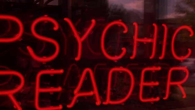 Trippy and weird psychic reader neon sign going in an out of focus, smooth but random movement