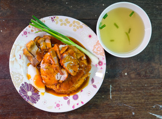 Khao Moo Dang or barbuced red pork in sauce with rice. A single
