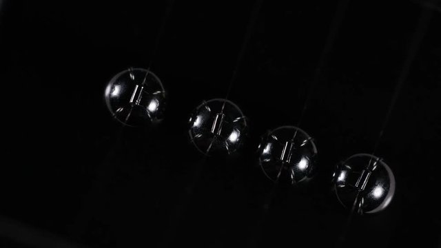 4K Abstract angle of Newton's cradle spheres in slow motion