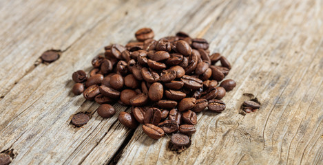 Coffee beans on a wooden surface