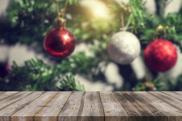 Christmas holiday background with empty wooden deck table over w