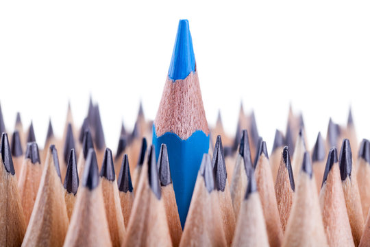 One sharpened blue pencil among many ones