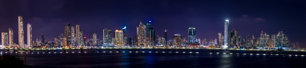 Fototapeta na wymiar Panoramic view of Panama City Skyline at night - Panama City, Panama