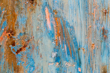 A background of peeling paint and rusty old metal
