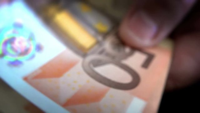 Money Shuffle, 50 euro bills extreme closeup