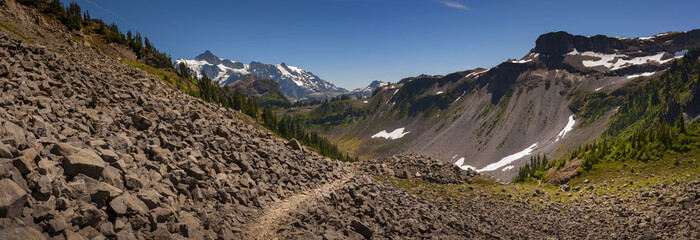 Mt. Shuksan, Washington.  Mount Shuksan may be one of the most photographed mountains in the Cascade Range seen here on the Chain Lakes Loop Trail. Mt. Baker National Forest.