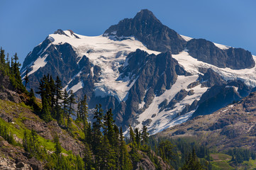 Mt. Shuksan, Washington.  Mount Shuksan may be one of the most photographed mountains in the Cascade Range seen here on the Chain Lakes Loop Trail. Mt. Baker National Forest.
