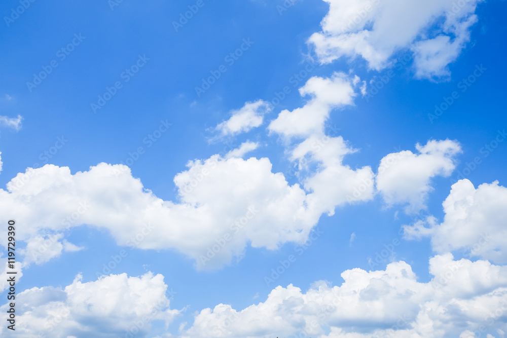 Wall mural blue sky with clouds background in the sun light