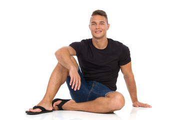 Handsome Young Male Model Sitting On Floor