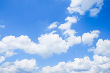 Naklejka na ściany i meble Blue sky with clouds background in the sun light