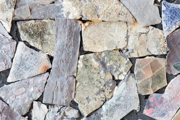 Colorful old stone mosaic on the wall.
