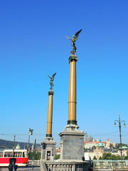 columns with angels at the beginning of the bridge in Prague - Czech Republic