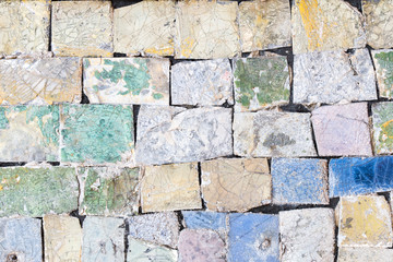 Colorful old stone mosaic on the wall.