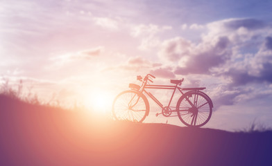 Obraz premium beautiful landscape image with Bicycle at sunset