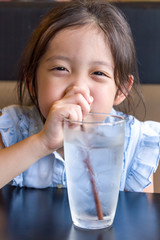 Child Drinking Water from Glass