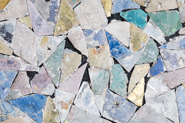 Colorful old stone mosaic on the wall.