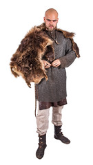 Medieval viking in chain mail and a bearskin rug. Isolated on white