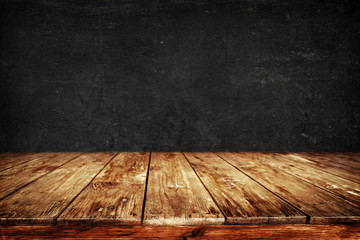 Old wood table with blackboard background - Empty ready for your product display or montage....