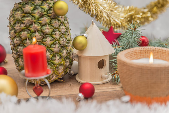 Alternative decorated Christmas tree surrounded by pineapple Christmas decorations