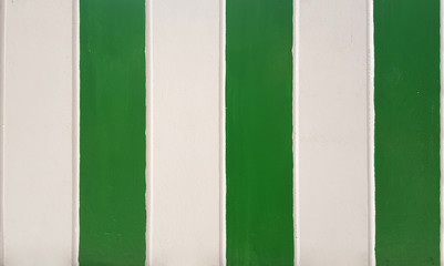 Vertical plank, green and white painted wood wall