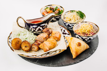 Healthy barbecue different meat with vegetables and sauce.