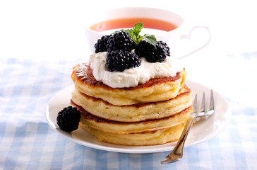 Pancakes with sour cream and blackberry