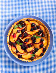 Fruit and berry tart on plate