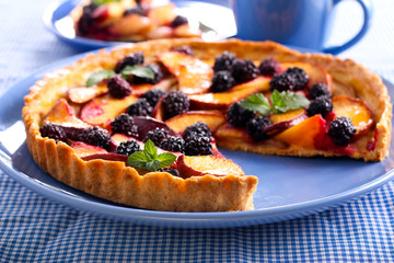 Fruit and berry tart on plate