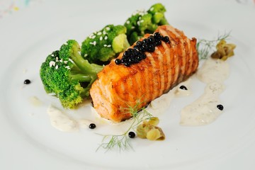 steak red fish on a background cauliflower closeup