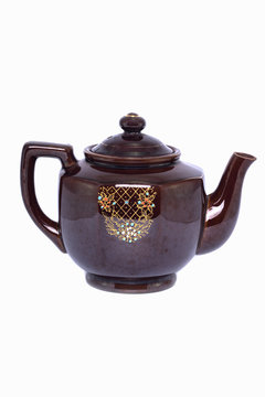 The vintage ceramic teapot isolated on a white background
