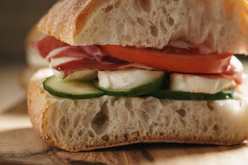 italian ciabatta sandwich with speck and mozzarella