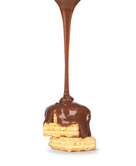 on vanilla wafer pouring chocolate on white background