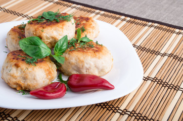 Closeup view of the fried meatballs on a striped background