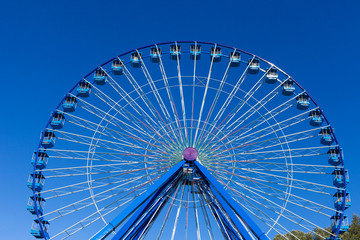 Ferris wheel with blue sky in the background
