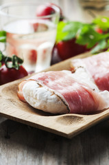 Traditional italian cheese tomino with bacon