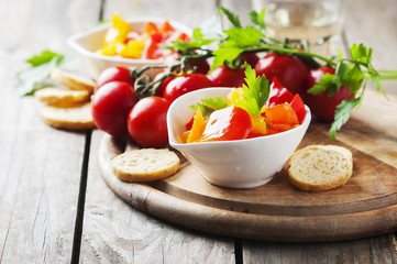 Italian sweet-sour paprika with bread and tomato