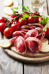 Fresh salami with tomato and bread
