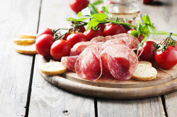 Fresh salami with tomato and bread