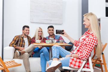 People taking selfie friends pictures drinking coffee shop with barista sitting table mix race men hold smart phone