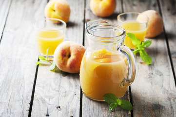 Fresh peach juice with mint on the wooden table